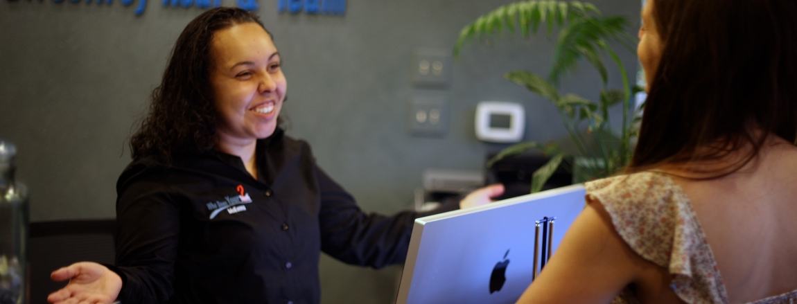Dental team member talking with a patient